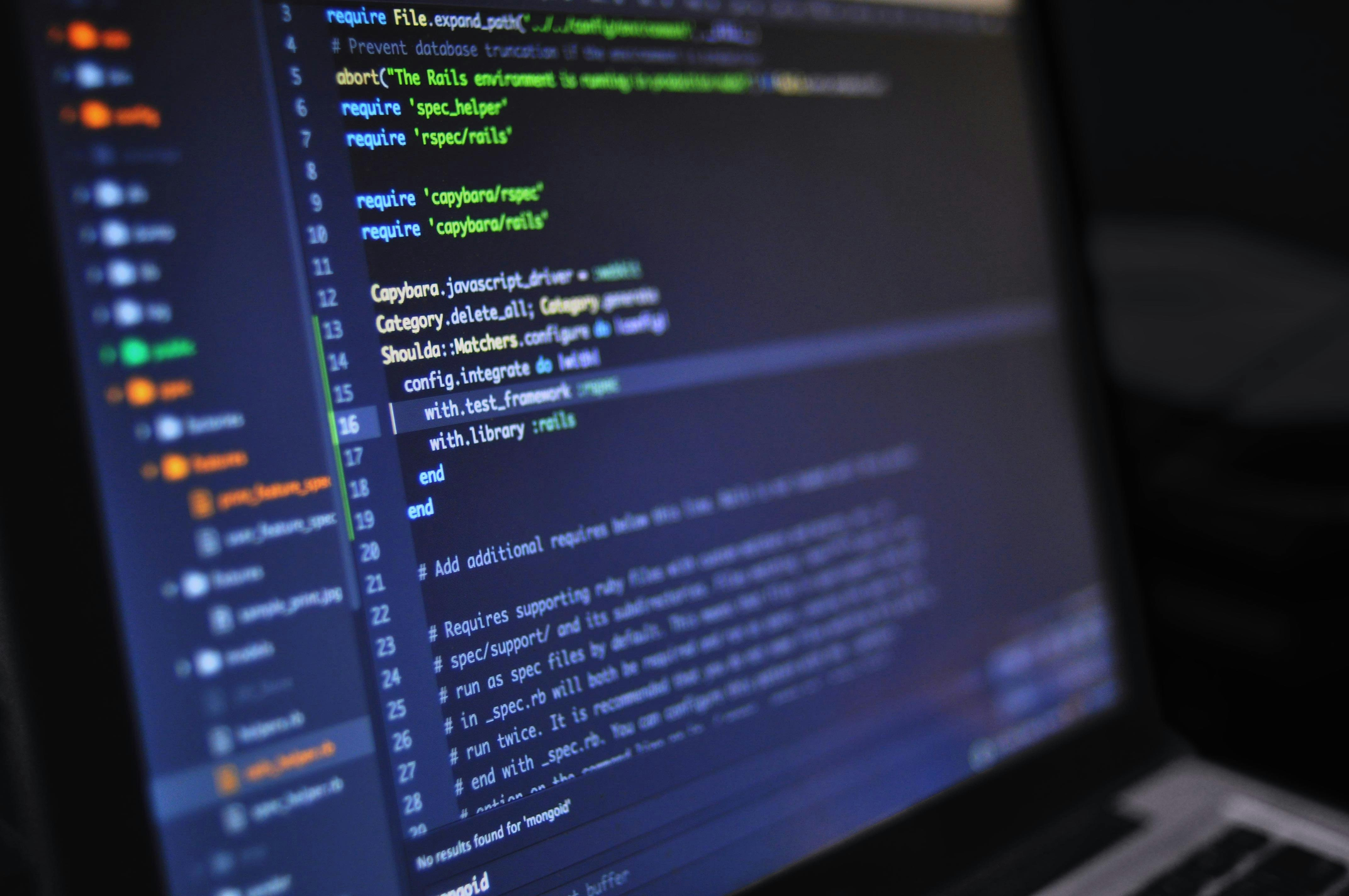 An image of Rails code on a laptop screen.
